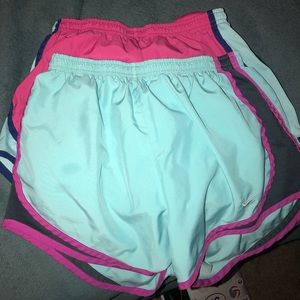Two pairs of nike running shorts